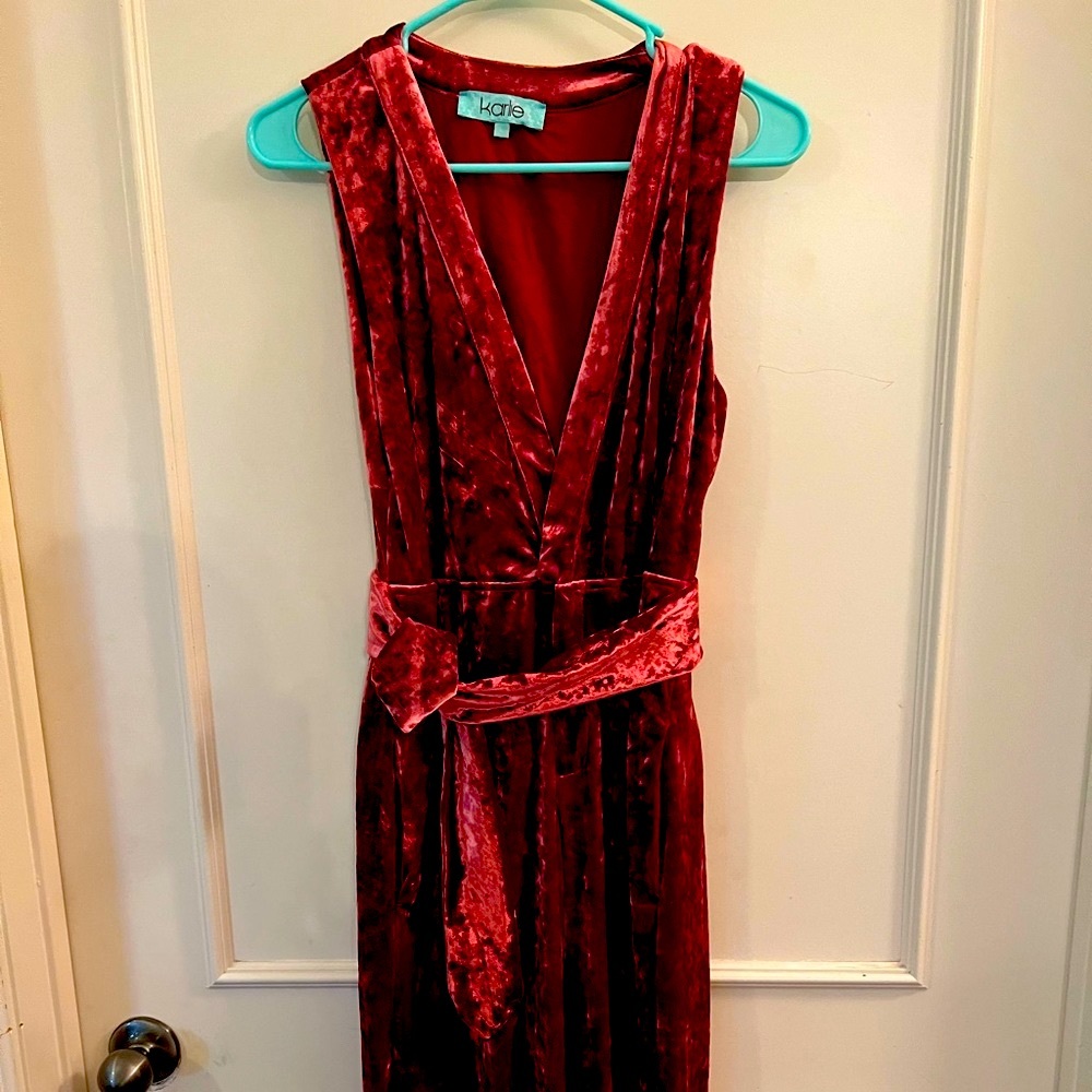 1970’s style crushed burgundy velvet jumpsuit. Has back cutout, wide leg